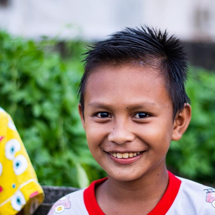 Aria Shah, Lead Design Curator at Plateau Core Studio, reviewing corporate floral arrangements